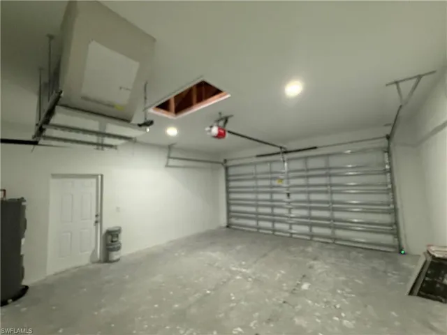 Garage featuring water heater