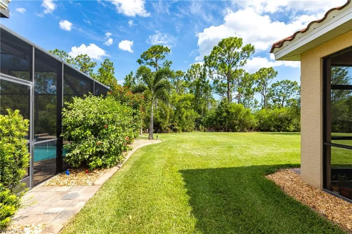 View of yard featuring a lanai