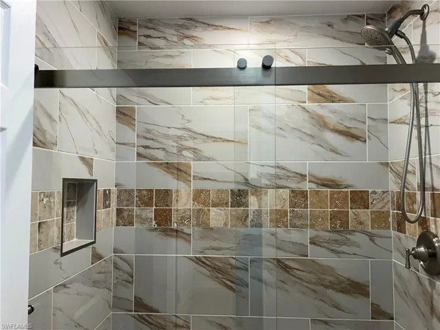 Updated nicely tiled to ceiling shower area