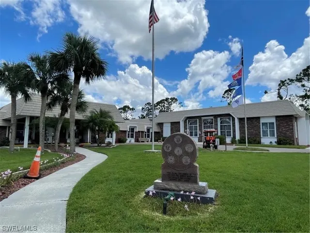 Expansive lawn with mature palm trees