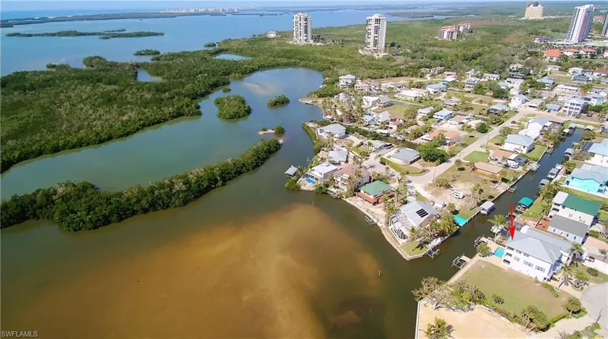 Very short run to the bay. Birds eye view of property with a water view