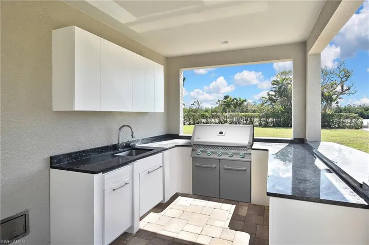 View of patio / terrace featuring sink, grilling area, and exterior kitchen VIRTUAL GRILL