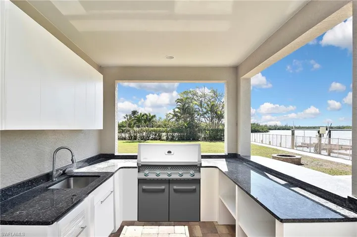 View of patio / terrace featuring an outdoor kitchen, sink, and area for grilling VIRTUAL GRILL