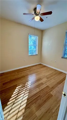 Unfurnished room featuring light wood-style floors and a ceiling fan
