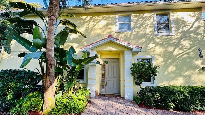 View of exterior entry with stucco siding