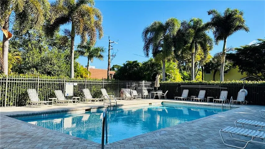 Community pool with a patio