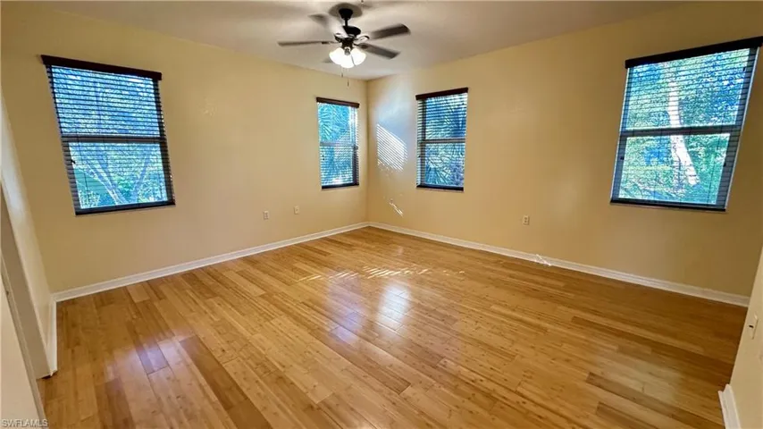 Unfurnished room with light wood-style flooring and a ceiling fan