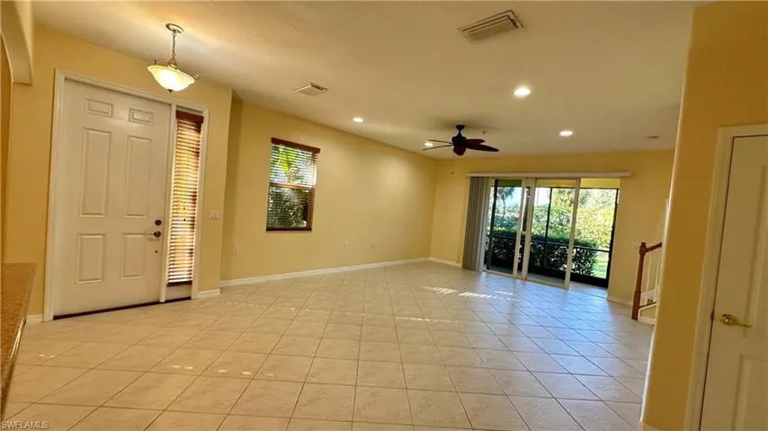 Foyer with recessed lighting, ceiling fan, and light tile patterned floors