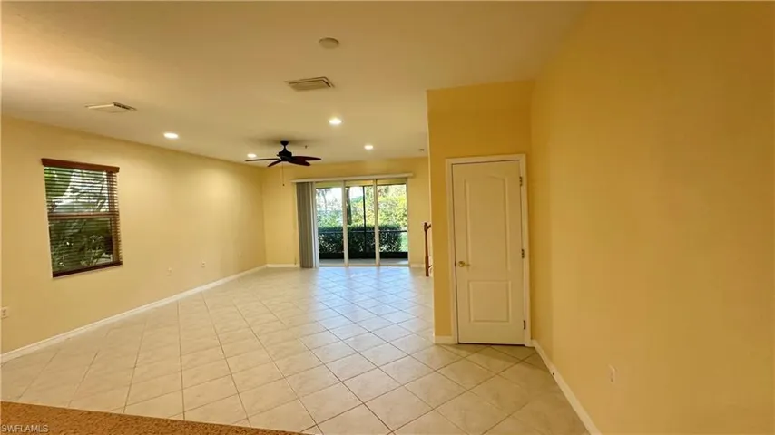 Empty room featuring light tile patterned flooring, recessed lighting, and a ceiling fan