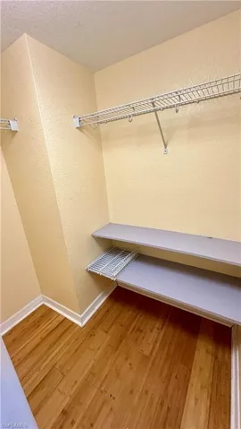 Walk in closet featuring light wood-type flooring