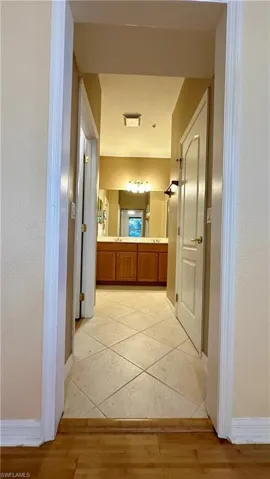 Hallway with baseboards and light wood-type flooring