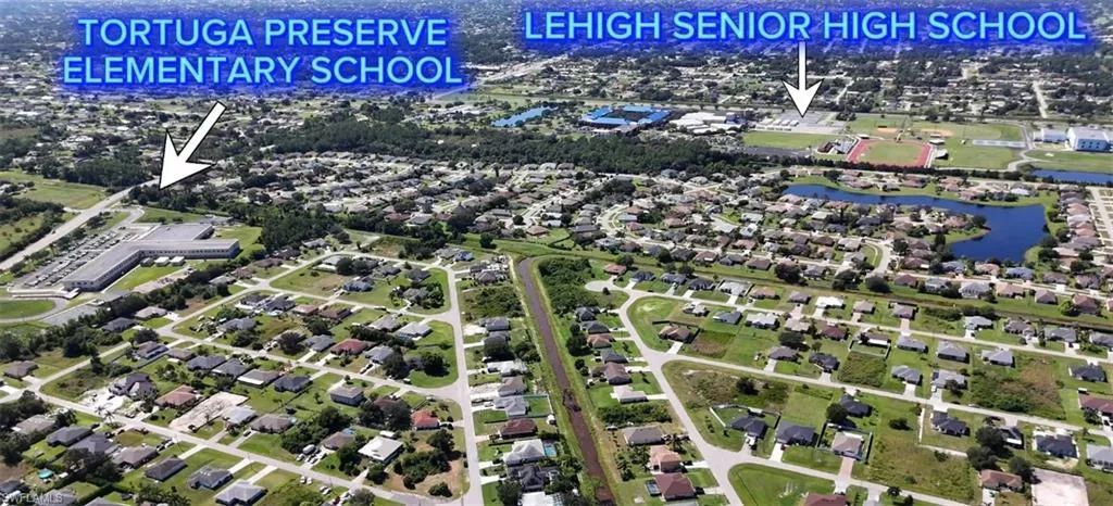 Aerial overview of property's location featuring nearby suburban area and a large body of water