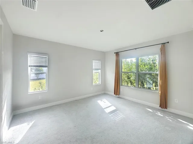 featuring baseboards and carpet