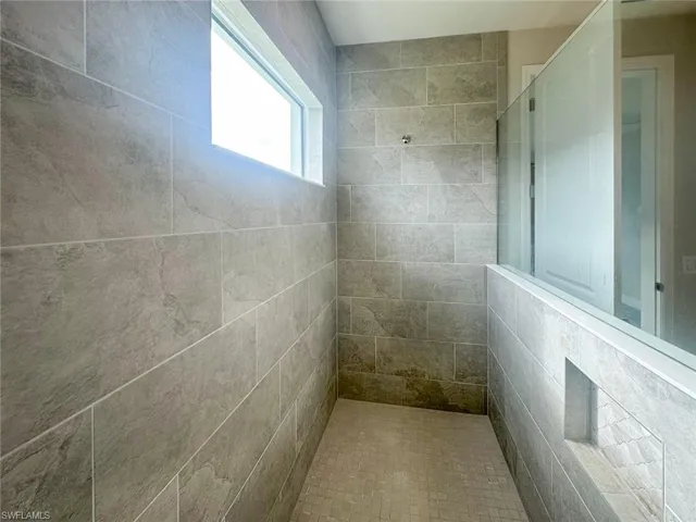 Bathroom with a tile shower
