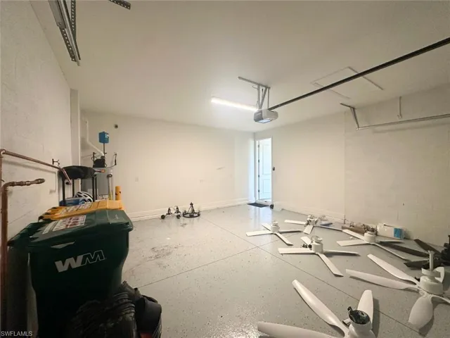 Garage with concrete block wall and a garage door opener