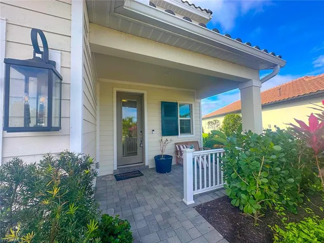 View of exterior entry featuring covered porch