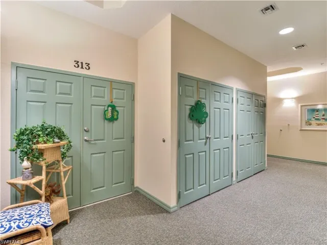 Entry to condo has french doors