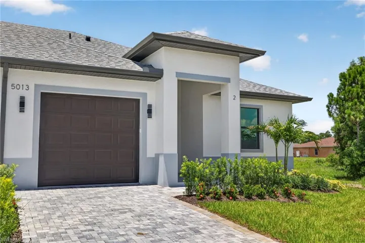Modern stucco exterior with gray trim accents