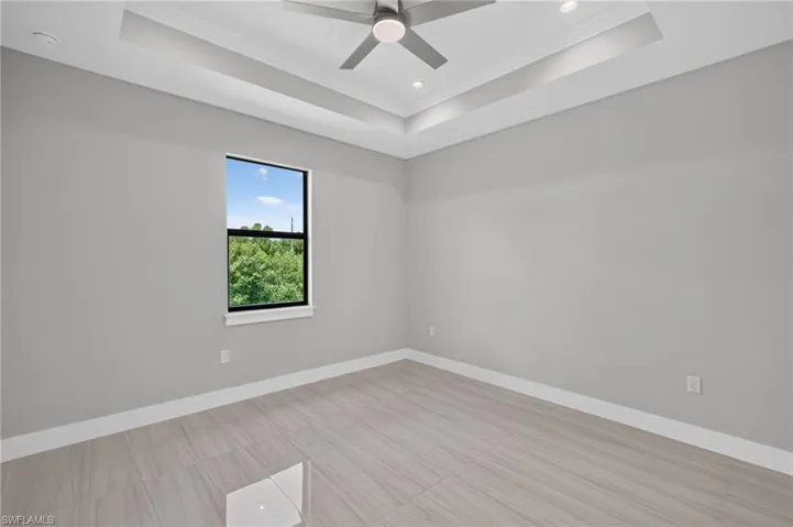 Recessed tray ceiling with crown molding and ceiling fan