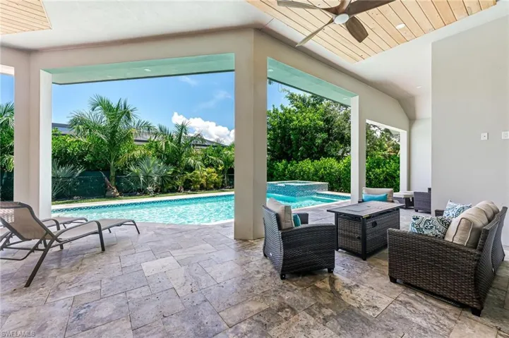 View of swimming pool with outdoor lounge area, a patio, and a pool with connected hot tub