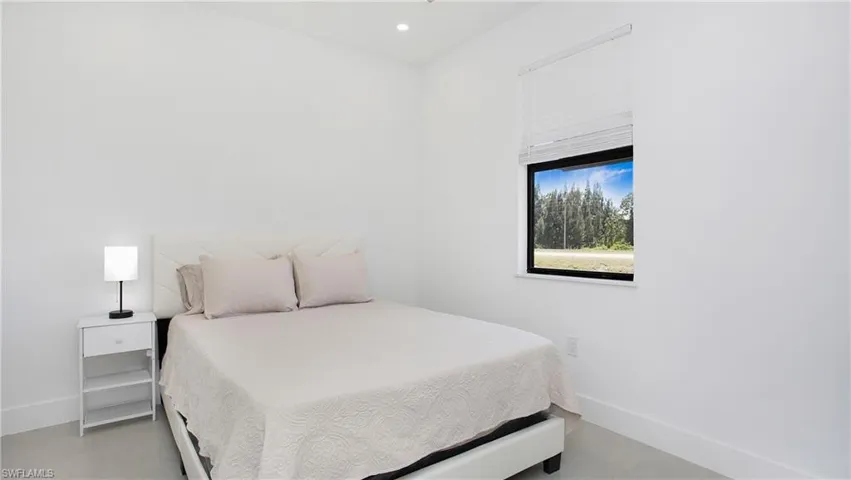 Bedroom featuring baseboards and recessed lighting