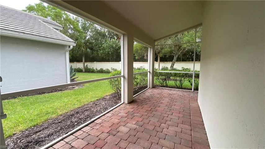Unfurnished sunroom with lofted ceiling