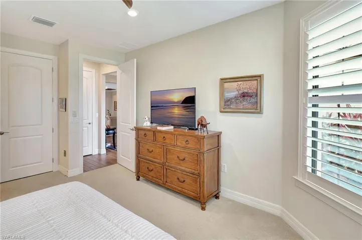 Bedroom featuring light colored carpet and recessed lighting