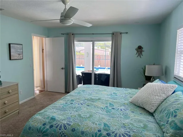 MASTER WITH SLIDING GLASS DOOR TO POOL
