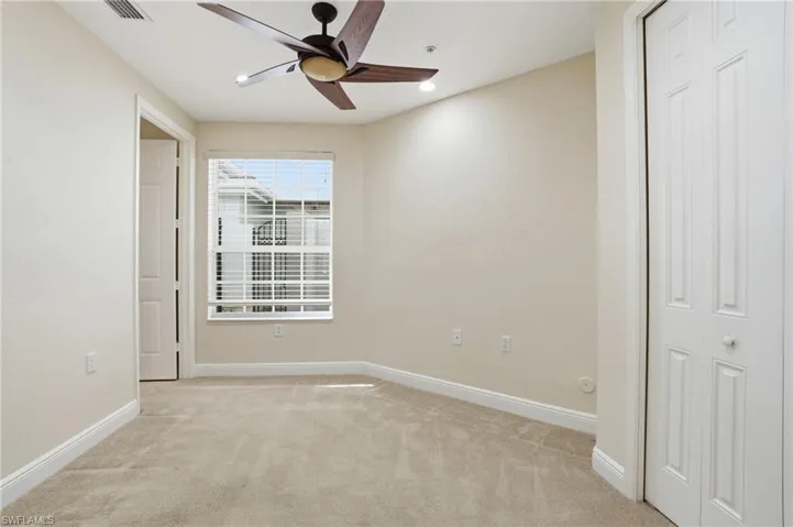 Bedroom  3 with light carpet and a ceiling fan