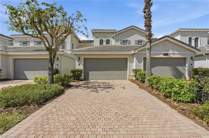 Mediterranean / spanish home with stucco siding and decorative driveway