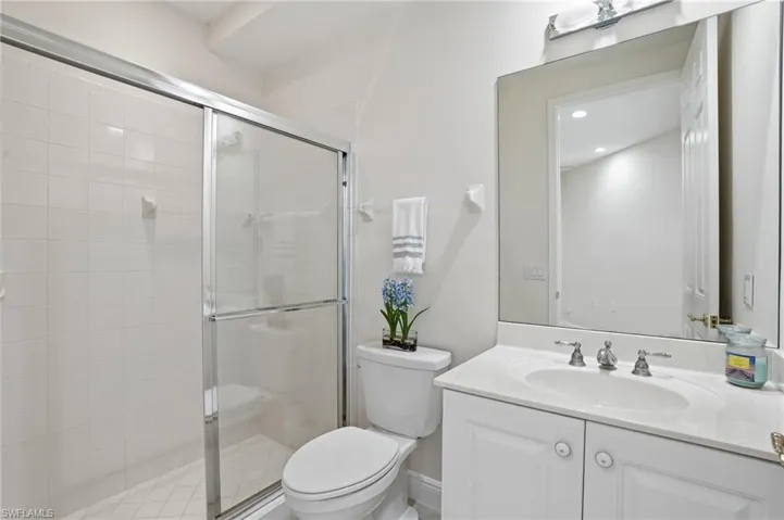 Bathroom 3 featuring vanity and a shower stall