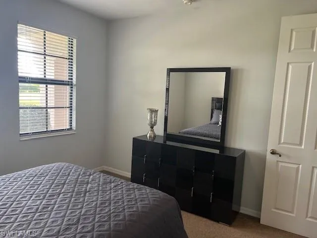 Bedroom featuring carpet flooring