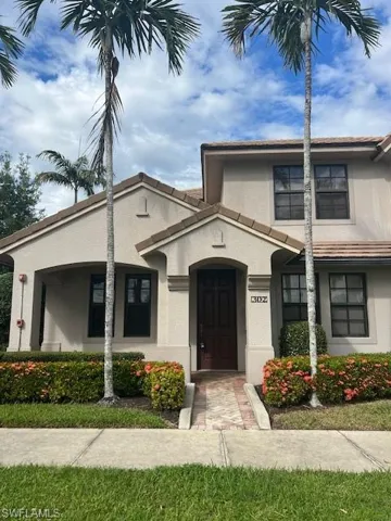 View of front of house featuring stucco siding