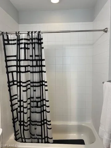Full bath upstairs  featuring shower / bathtub combination with curtain and recessed lighting