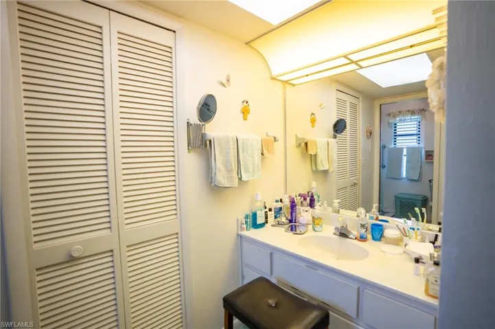En-suite Master Bathroom featuring a closet and vanity