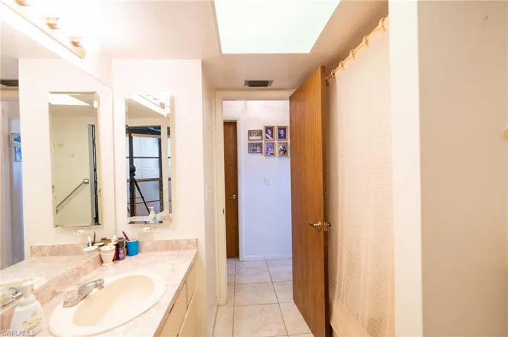 Full bathroom featuring vanity and tile patterned floors