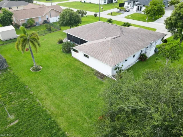 Beautifully Manicured triple lot with fruit tree