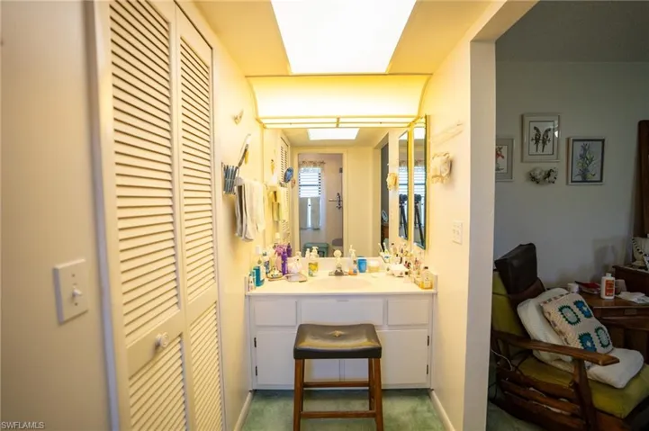 Master Bathroom featuring vanity and a closet