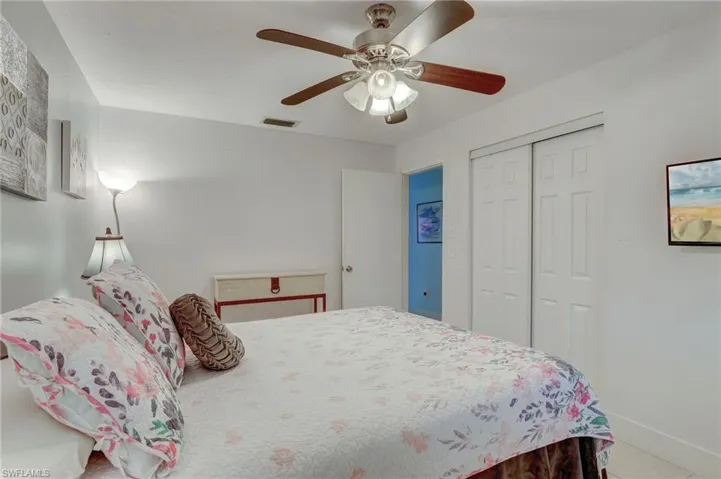 Bedroom featuring ceiling fan and a closet