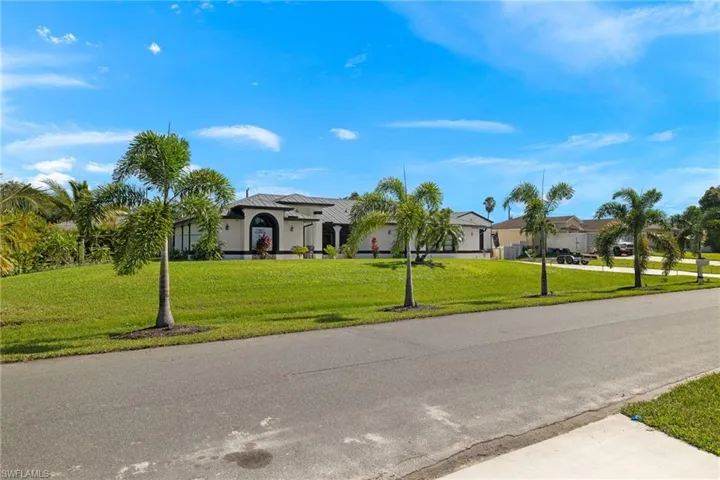 Ranch-style home featuring a front yard