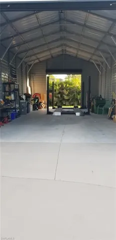 Garage featuring a carport