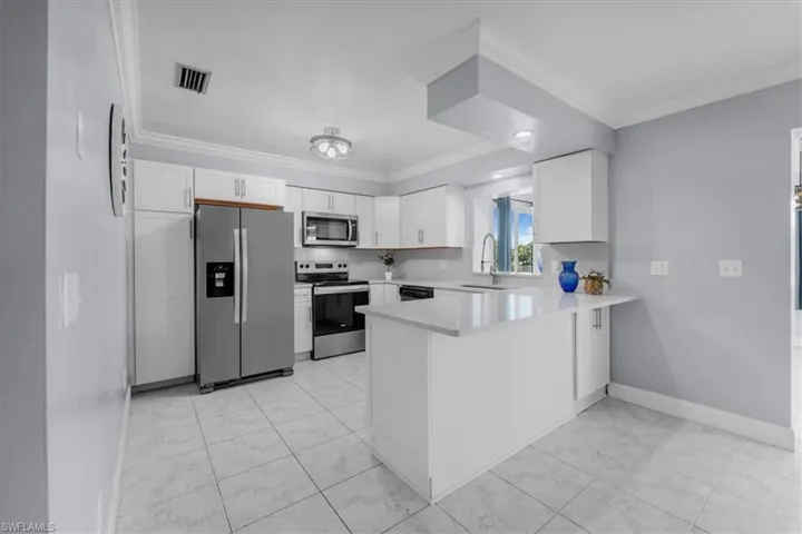 Breakfast bar and pass through to bonus room