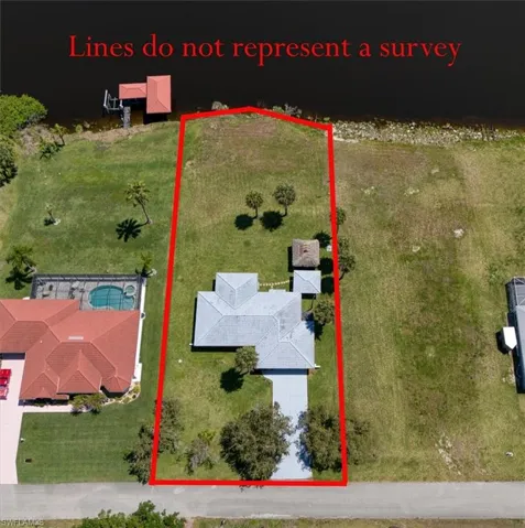 Aerial view of home with waterfront views