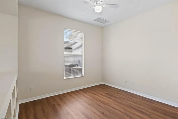 Cozy sitting/office nook within the primary bedroom, offering a quiet space for work or relaxation just steps from your personal retreat.