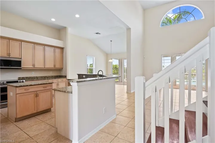 A thoughtfully located half bathroom adjacent to the kitchen, offering practicality and easy access for guests and family without interrupting main living areas.
