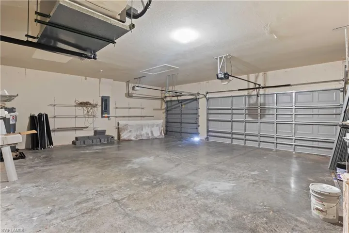 An oversized three-bay garage with ample storage space and direct access to the home.
