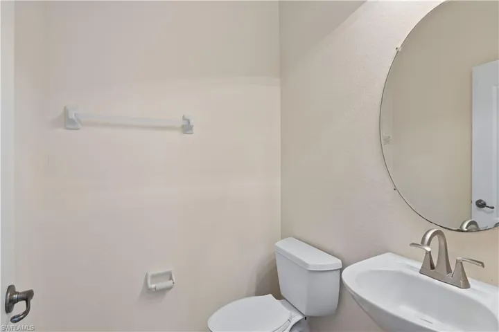 Charming powder room, offering practicality and elegance just steps from the main living areas.