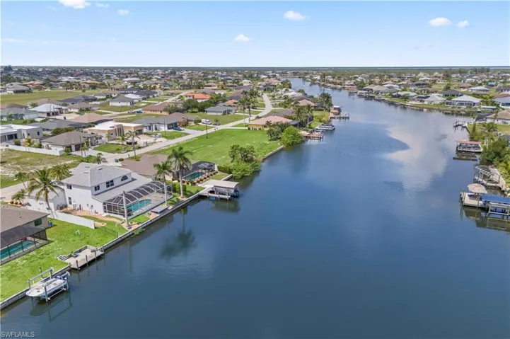 Sweeping views of the 247-foot wide Gator Slough Canal, providing direct Gulf access via one bridge under Old Burnt Store Road.