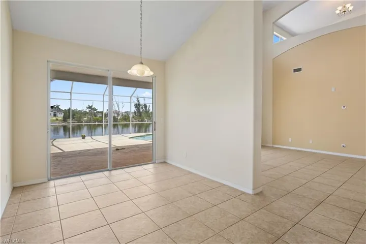 A cozy eat-in area offering serene canal views, perfect for casual meals.