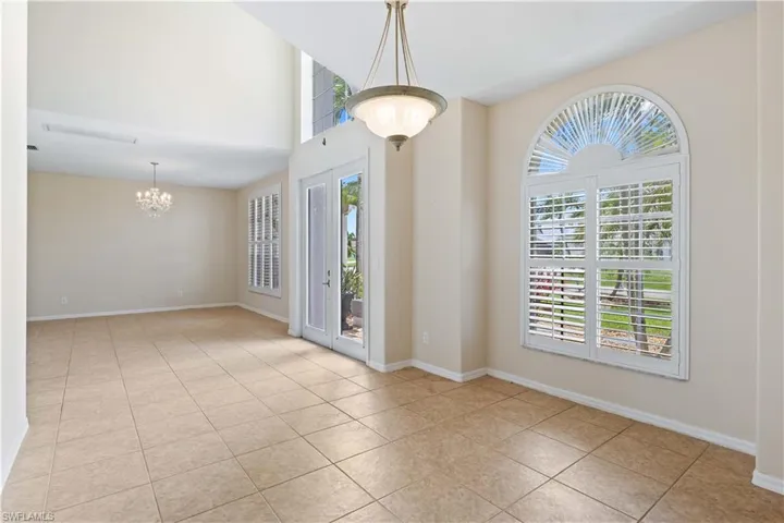 A spacious dining area with ample natural light, ideal for hosting dinner parties and family gatherings.